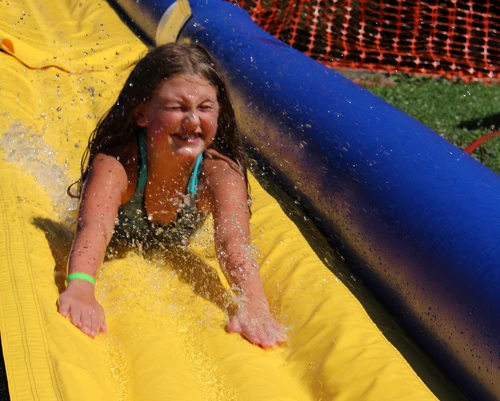 Girl on slip and slide